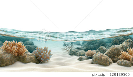 A rocky beach with a clear blue ocean in the background 129189500