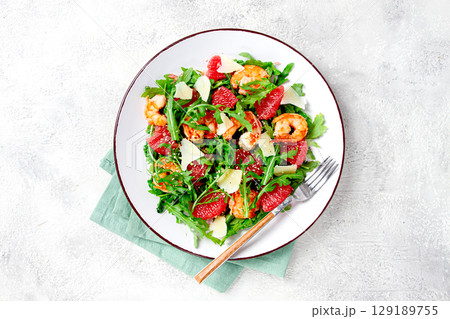 Fresh shrimp salad with arugula, grapefruit, and parmesan served in a bowl Fresh shrimp salad with arugula, grapefruit, and parmesan served in a bowl 129189755