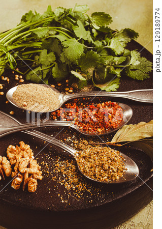 Georgian spices in spoons, on ketsi, top view, no people, Georgian spices in spoons, on ketsi, top view, no people, 129189774