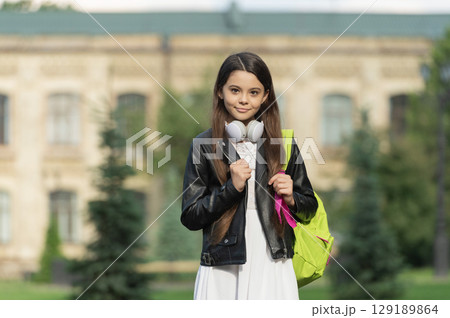 Teen girl school student outdoor. Teeny lifestyle. Student life. Listen to music in headphones. Teen girl generation. Lifestyle and education. Back to school. School education. Adolescence lifestyle Teen girl school student outdoor. Teeny lifestyle. Student life. Listen to music in headphones. Teen girl generation. Lifestyle and education. Back to school. School education. Adolescence lifestyle 129189864