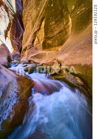 Flowing Water in Kanarra Slot Canyon Sandstone Walls Low Angle Perspective 129192128
