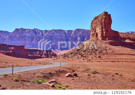 Red Sandstone Butte and Winding Desert Road in Arizona Southwest Eye Level Red Sandstone Butte and Winding Desert Road in Arizona Southwest Eye Level 129192176