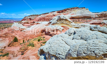 Aerial Through of White Pocket Sandstone Layers and Swirling Vermilion Cliffs Aerial Through of White Pocket Sandstone Layers and Swirling Vermilion Cliffs 129192199