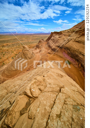 Sandstone Rock Formations and Desert Plain with Dramatic Sky High Vantage 129192254