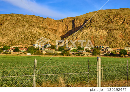 Suburban Homes and Farmland at Desert Cliffs Edge Eye Level View Suburban Homes and Farmland at Desert Cliffs Edge Eye Level View 129192475