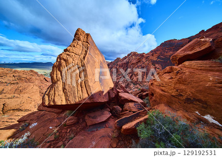 Red Sandstone Boulder and Rugged Cliffs in Red Rock Canyon Eye Level View Red Sandstone Boulder and Rugged Cliffs in Red Rock Canyon Eye Level View 129192531