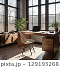 朝の自然光が差し込むオフィスで、デスクの上にノートパソコンが置かれている2 129193268