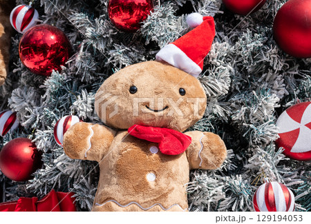 Cute soft doll decorated on Christmas tree during Christmas festival and New Year celebration. 129194053