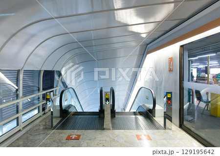 Escalator machine in modern building. 129195642