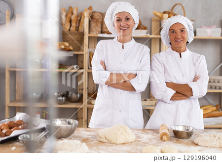 Two female bakers posing in workshop 129196040