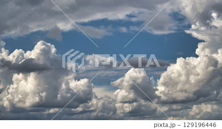A beautiful view of clouds and a blue sky, perfect for backgrounds. 129196446