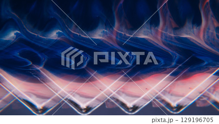 Angle pattern. Color ink wave. Defocused blue pink neon sparkling pigment wet particles pour on abstract acrylic vivid geometric background. 129196705