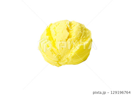 Yellow butter scoop placed on a white surface, isolated on white, PNG 129196764
