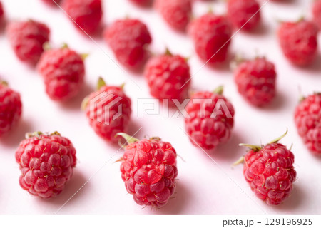 Fresh ripe raspberry with leaf on pink background, Summer fruit 129196925