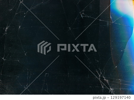 Cracked screen. Glitch glow flare. Fiction damaged scratch defocused black background copy space. Distressed display distortion surface. 129197140