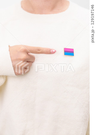 Bisexuality Celebrate Day and LGBT pride month, LGBTQ or LGBTQIA concept. Hand holding purple, pink and blue flag shape for Lesbian, Gay, Bisexual, Transgender, Queer, Pansexual, Marriage Equality Law Bisexuality Celebrate Day and LGBT pride month, LGBTQ or LGBTQIA concept. Hand holding purple, pink and blue flag shape for Lesbian, Gay, Bisexual, Transgender, Queer, Pansexual, Marriage Equality Law 129197146