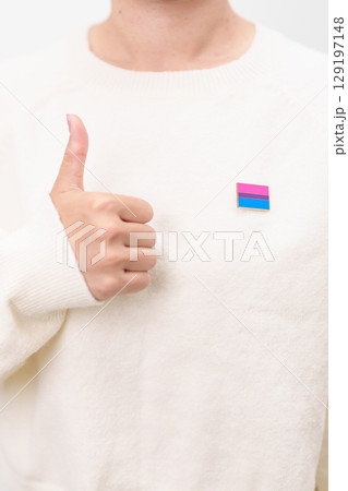 Bisexuality Celebrate Day and LGBT pride month, LGBTQ or LGBTQIA concept. Hand holding purple, pink and blue flag shape for Lesbian, Gay, Bisexual, Transgender, Queer, Pansexual, Marriage Equality Law 129197148