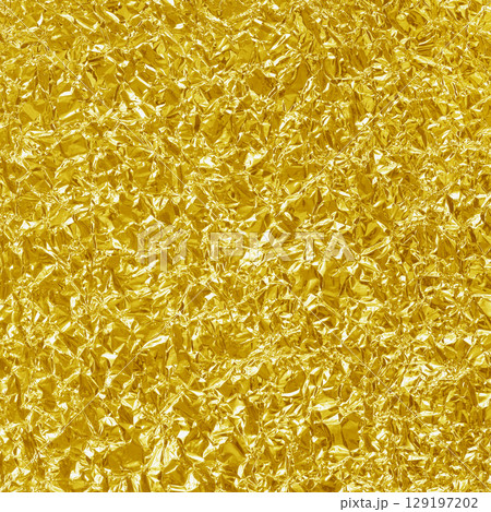 Gold foil leaf shiny texture, abstract yellow wrapping paper for background and design art work. 129197202
