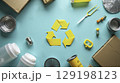 Yellow recycling symbol surrounded by various types of recyclable materials 129198123