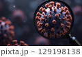 3D close-up of virus under magnifying glass, showing red spike proteins  129198138