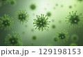 Microscopic view of green virus cells floating in a greenish fluid environment 129198153