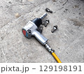 Pneumatic Air Impact Wrench with Lug Nuts. Car Tire Repair 129198191
