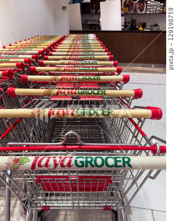 Taya Grocer supermarket shopping carts lined up in Penang, Malaysia 129198759