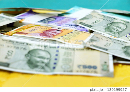 piles of new indian currency notes rupees 50,100,200 and 500 129199927