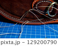 The process of leather processing, making a seam 129200790