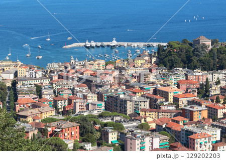 Camogli, Italy - 11 July 2025. Yachts, boats in bay of Liguria. Sea and tourism in Italy. Traditional buildings. Background for design. Camogli, Italy - 11 July 2025. Yachts, boats in bay of Liguria. Sea and tourism in Italy. Traditional buildings. Background for design. 129202203