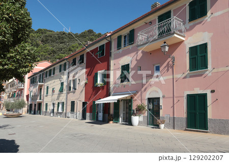 Old street in Italian countryside near sea. Traditional building. Sun day. Entrance, window to house. Nature and sky. 129202207