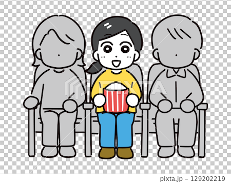 Smiling woman watching a movie alone at the cinema 129202219