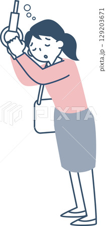 つり革につかまったまま居眠りする若い女性 129203671