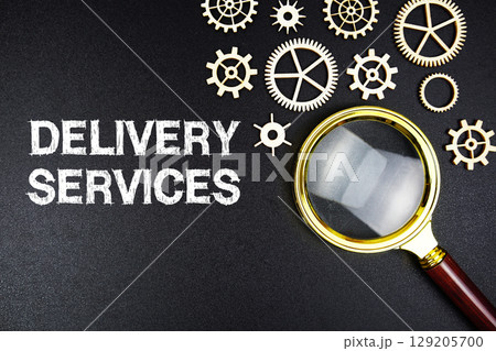 Delivery Services text message with magnifying glass on black background 129205700