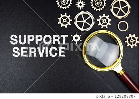 Support Service text message with magnifying glass on black background 129205707