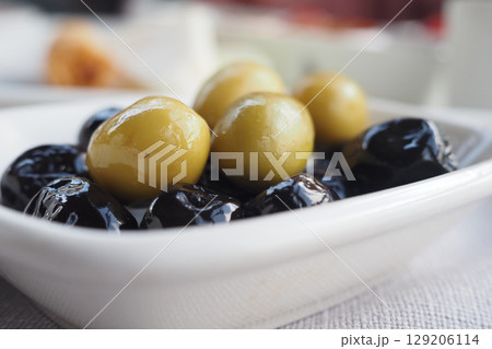 Olives displayed on a plate at a Mediterranean restaurant 129206114