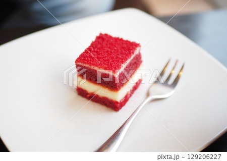 Red velvet cake served on a white plate in a cafe Red velvet cake served on a white plate in a cafe 129206227