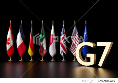 Flags of G7 member countries stand proudly in a row, showcasing diverse nations united for international collaboration and dialogue on pressing global issues. 3D render. 129206383