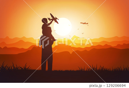 Father and son silhouette with toy airplane at sunset 129206694