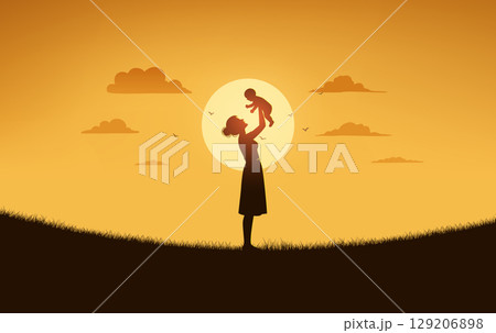 Silhouette of Mom Lifting Baby at Sunset in Meadow Silhouette of Mom Lifting Baby at Sunset in Meadow 129206898
