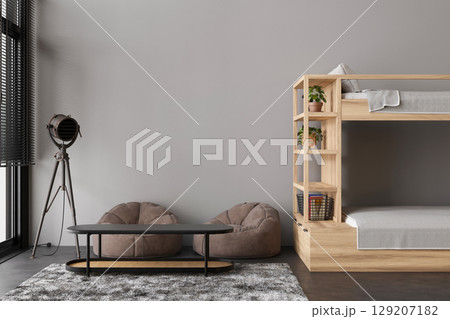 This hostel interior showcases a minimalist design with wooden bunk beds, bean bag chairs, and a sleek table. A warm atmosphere invites guests to relax and socialize in comfort This hostel interior showcases a minimalist design with wooden bunk beds, bean bag chairs, and a sleek table. A warm atmosphere invites guests to relax and socialize in comfort 129207182