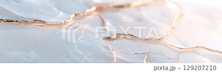 A smooth water background features soft frost and delicate gold veins running through ice cracks, enhancing the atmosphere with a modern luxury feel that captivates the viewer 129207210