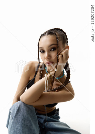 beautiful girl with braids. young woman with tressed hairstyle. hip-hop dancer beautiful girl with braids. young woman with tressed hairstyle. hip-hop dancer 129207284