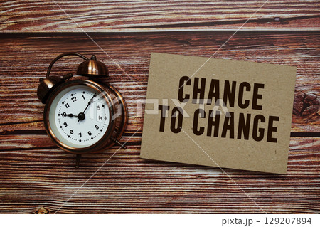 Chance To Change text with alarm clock on wooden background 129207894