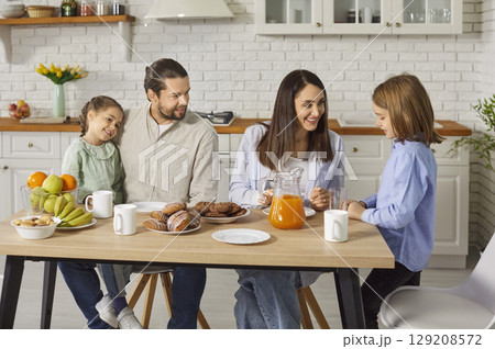 Parents And Children Eating Together At Home Parents And Children Eating Together At Home 129208572