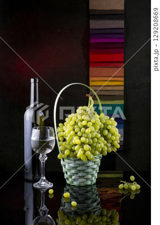 Still life with grapes and wine in glasses 129208669
