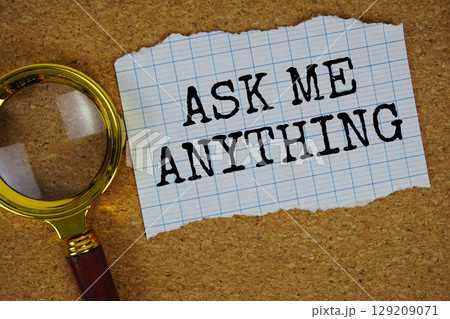 AMA Ask Me Anything text written on paper with magnifying glass 129209071