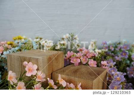 Wooden podium display scene stage showcase front view with copy space and flowers decoration 129210363