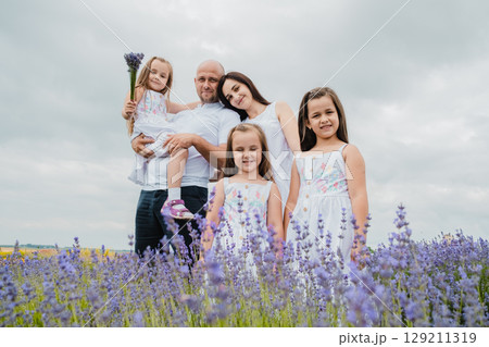 The family stands in the lavender field 129211319