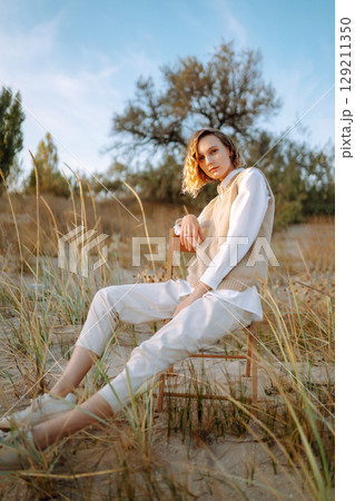 Portrait of elegant, luxury woman posing in nature. People, lifestyle, relaxation concept. 129211350